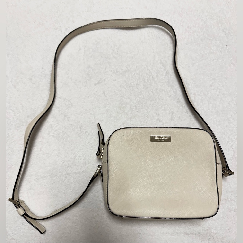 Kate Spade Newbury Lane Cammie Cream Crossbody Bag with Black and Gold Accents